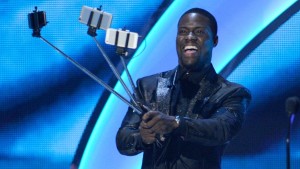 Kevin Hart with selfie sticks