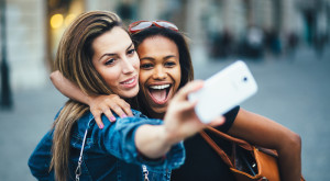 girls taking selfie
