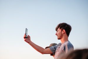 a man taking a selfie, blue sky, light, johan mouchet
