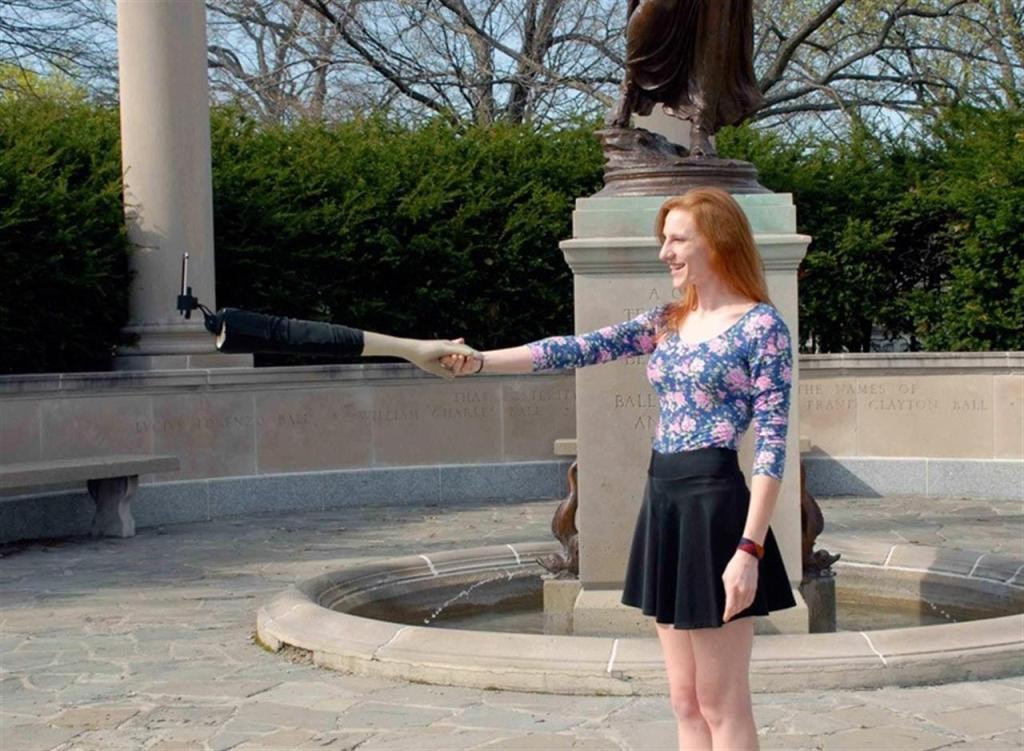 girl with a selfie stick arm in a parc